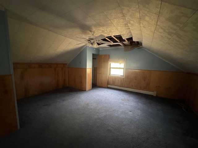 548 S 10th Ave, Mount Vernon, NY 10550 - bonus room with a wainscoted wall, wood walls, lofted ceiling, and a baseboard heating unit