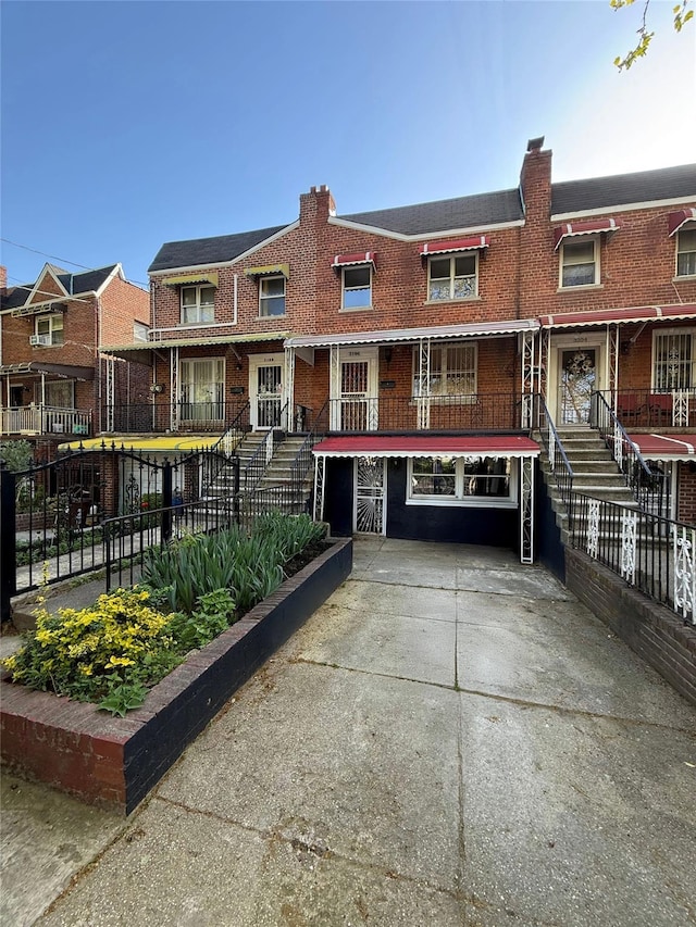 3106 Eastchester Rd, Bronx, NY 10469 - multi unit property featuring brick siding, driveway, and fence
