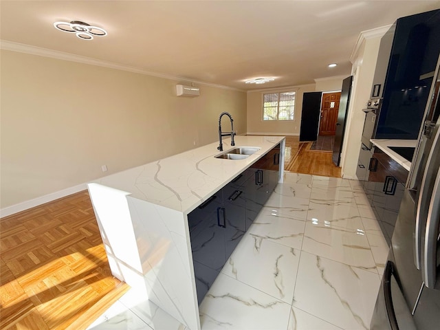 3106 Eastchester Rd, Bronx, NY 10469 - kitchen with a sink, a center island with sink, crown molding, baseboards, and modern cabinets