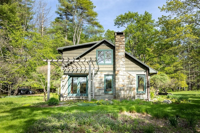 11 Louie Way, Woodstock, NY 12498 - rear view of house with a chimney, stone siding, and a pergola