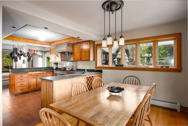 11 Louie Way, Woodstock, NY 12498 - dining space featuring a baseboard radiator, plenty of natural light, and a tray ceiling
