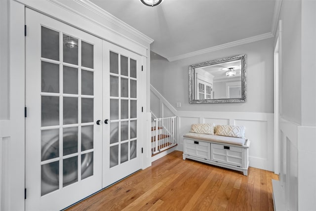32 Lafayette Ave, Beacon, NY 12508 - doorway to outside with crown molding, hardwood / wood-style flooring, wainscoting, french doors, and a decorative wall