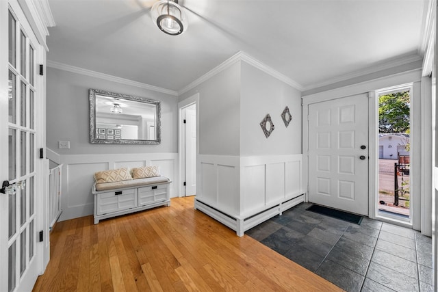 32 Lafayette Ave, Beacon, NY 12508 - foyer entrance with ornamental molding, wainscoting, and a baseboard heating unit