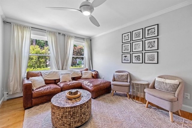 32 Lafayette Ave, Beacon, NY 12508 - living room featuring crown molding, light wood-style floors, and a ceiling fan