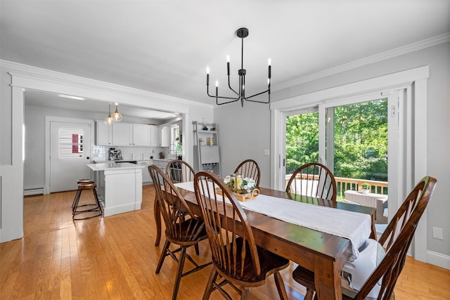32 Lafayette Ave, Beacon, NY 12508 - dining room with plenty of natural light, a chandelier, light wood-style flooring, a baseboard heating unit, and crown molding