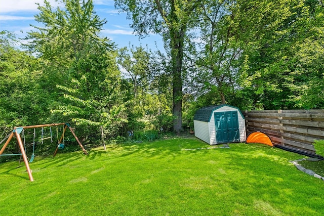 32 Lafayette Ave, Beacon, NY 12508 - fenced backyard with a storage shed and a playground