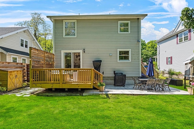 32 Lafayette Ave, Beacon, NY 12508 - rear view of house with a deck, a patio area, and a lawn
