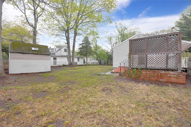view of yard with an outbuilding and a storage shed