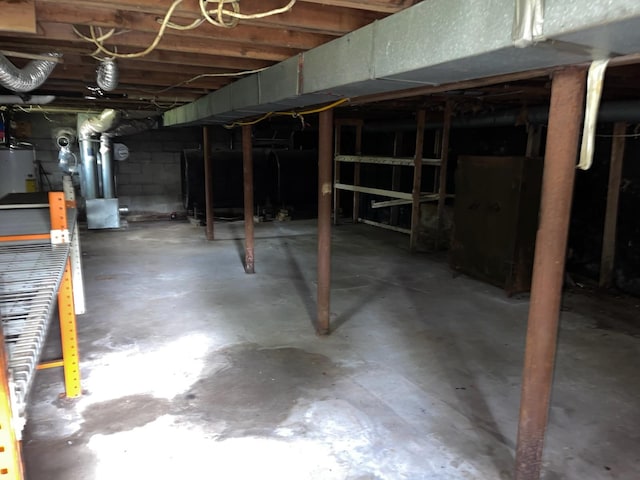 118 Fulton Ave, Mastic, NY 11950 - unfinished basement featuring oil tank and water heater