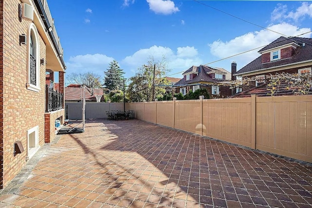 view of patio / terrace featuring fence