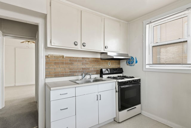 20-58 35th St, Astoria, NY 11105 - kitchen featuring gas stove, a sink, under cabinet range hood, light countertops, and backsplash