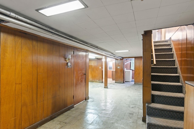 20-58 35th St, Astoria, NY 11105 - below grade area with stairs, wood walls, and tile patterned floors