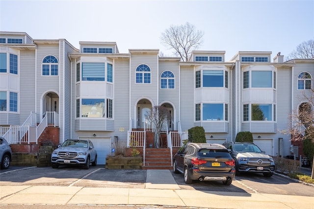 240-48 Oak Park Dr Unit A, Douglaston, NY 11362 - townhome / multi-family property with asphalt driveway and an attached garage