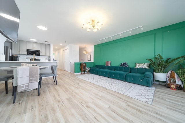 240-48 Oak Park Dr Unit A, Douglaston, NY 11362 - living area featuring a chandelier, light wood-type flooring, and recessed lighting