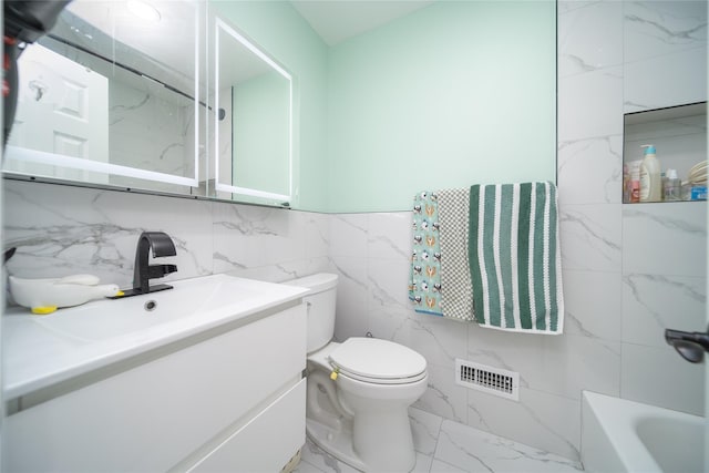 240-48 Oak Park Dr Unit A, Douglaston, NY 11362 - full bathroom with marble look tiles, toilet, vanity, and tile walls