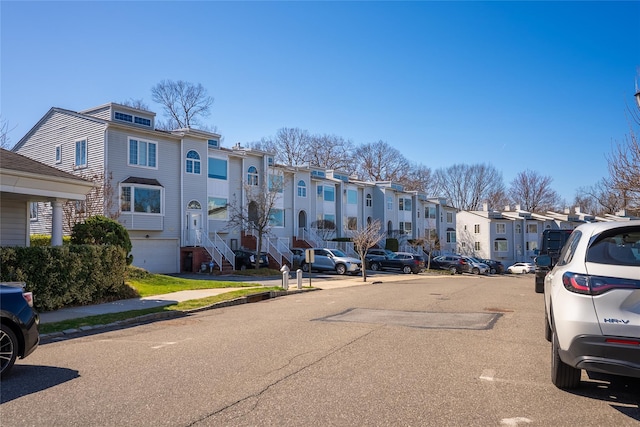 240-48 Oak Park Dr Unit A, Douglaston, NY 11362 - view of asphalt road featuring a residential view, sidewalks, and curbs