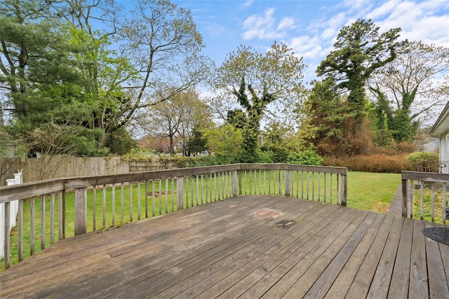 deck featuring a yard and fence