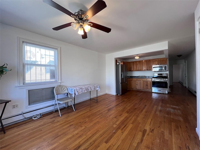 109-41 132nd St, South Ozone Park, NY 11420 - kitchen featuring stainless steel appliances, dark wood-style flooring, brown cabinetry, and ceiling fan