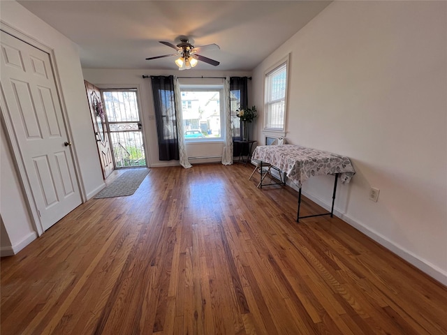 109-41 132nd St, South Ozone Park, NY 11420 - doorway to outside with healthy amount of natural light, dark wood-style flooring, and baseboards