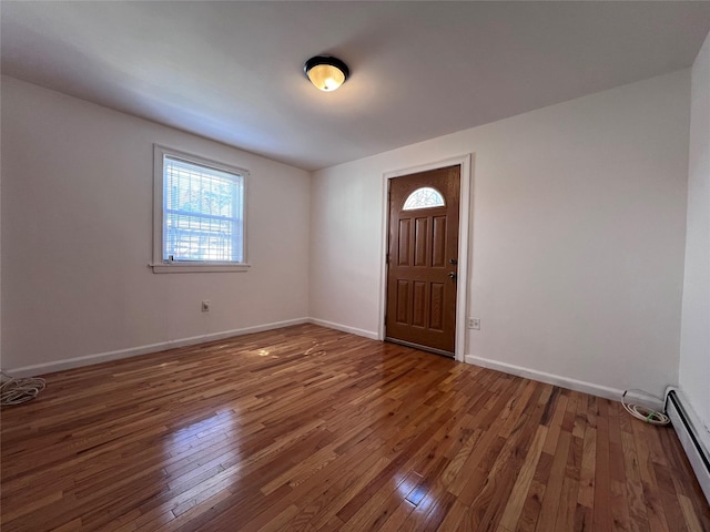 109-41 132nd St, South Ozone Park, NY 11420 - entryway with a baseboard heating unit, wood-type flooring, and baseboards