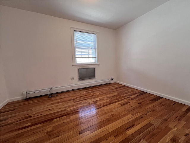 109-41 132nd St, South Ozone Park, NY 11420 - empty room with a baseboard radiator, wood finished floors, and baseboards