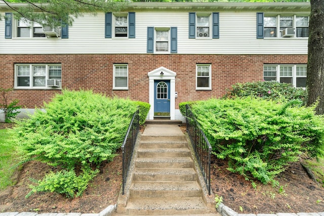 70 Underhill Ave Unit 1A, West Harrison, NY 10604 - doorway to property featuring brick siding and cooling unit