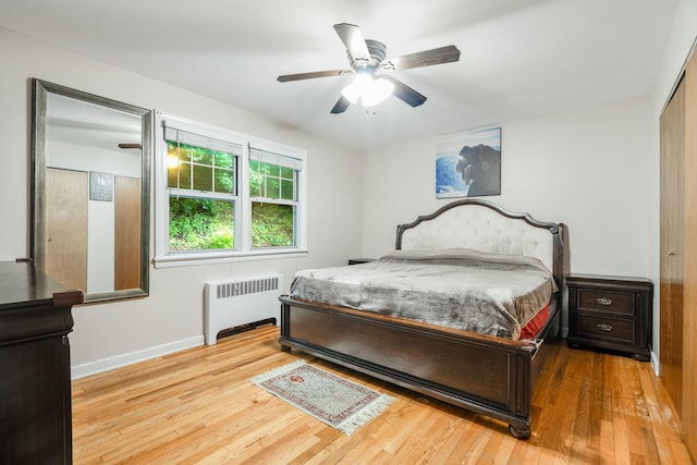 70 Underhill Ave Unit 1A, West Harrison, NY 10604 - bedroom with radiator heating unit, wood finished floors, baseboards, and a ceiling fan