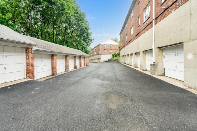 70 Underhill Ave Unit 1A, West Harrison, NY 10604 - view of asphalt road featuring community garages