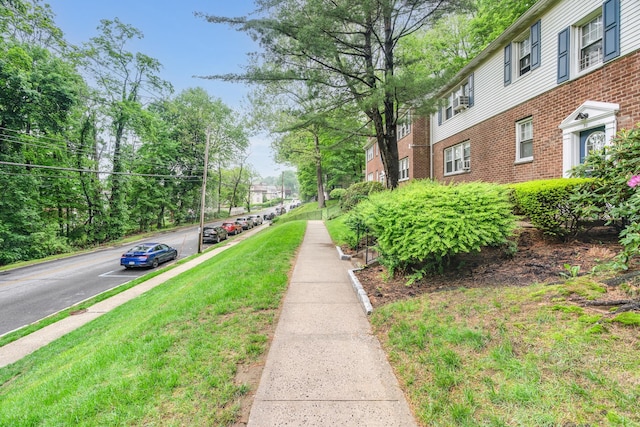 70 Underhill Ave Unit 1A, West Harrison, NY 10604 - view of asphalt road featuring sidewalks and curbs
