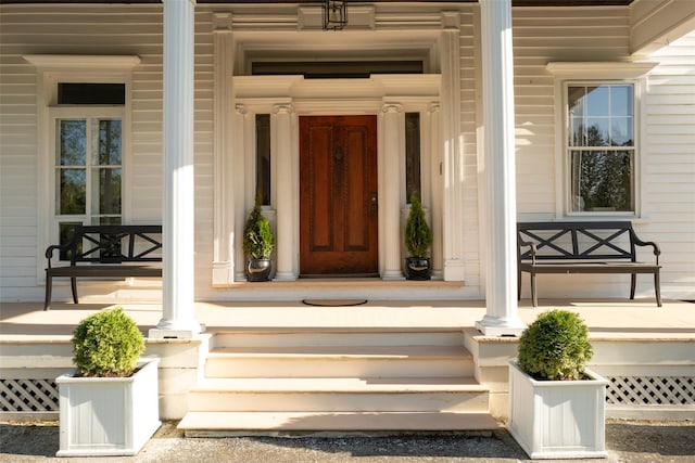 entrance to property featuring covered porch