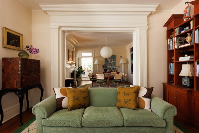 living room featuring crown molding and wood finished floors
