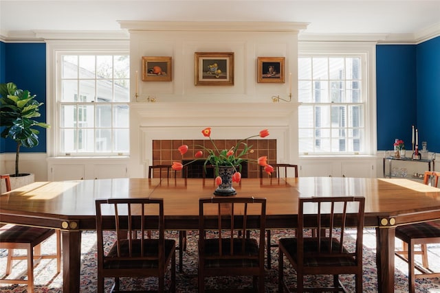 dining room featuring ornamental molding and plenty of natural light
