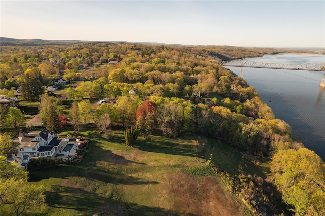 bird's eye view with a forest view and a water view