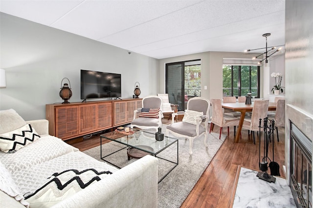 680 W Boston Post Rd Unit 3R, Mamaroneck, NY 10543 - living room with wood finished floors and a chandelier