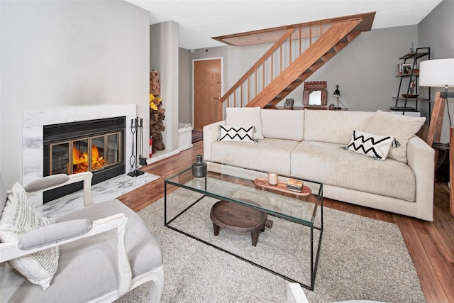 680 W Boston Post Rd Unit 3R, Mamaroneck, NY 10543 - living room with wood finished floors, stairway, and a high end fireplace