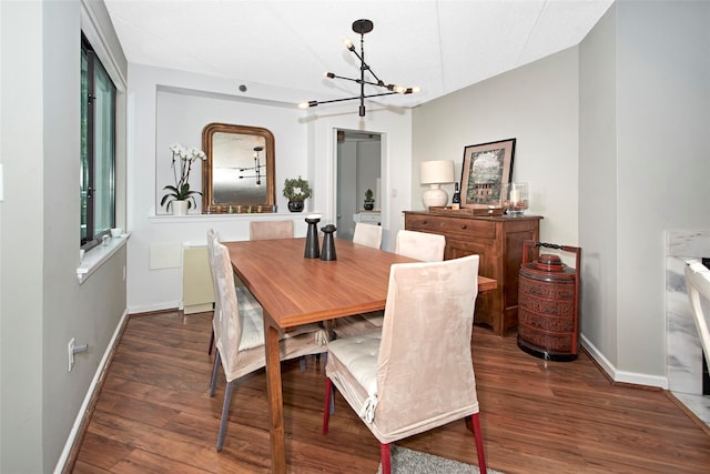 680 W Boston Post Rd Unit 3R, Mamaroneck, NY 10543 - dining space with a chandelier, baseboards, and wood finished floors