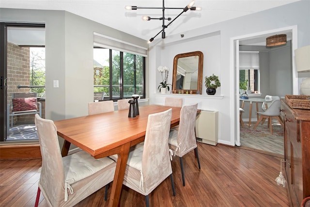 680 W Boston Post Rd Unit 3R, Mamaroneck, NY 10543 - dining area featuring wood finished floors, a chandelier, and baseboards