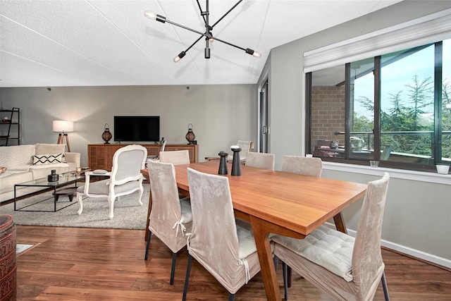 680 W Boston Post Rd Unit 3R, Mamaroneck, NY 10543 - dining room featuring wood finished floors, a chandelier, and baseboards
