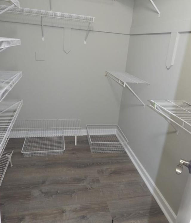 680 W Boston Post Rd Unit 3R, Mamaroneck, NY 10543 - walk in closet featuring wood finished floors