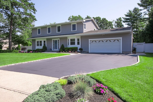 7 Jacqueline Ct, Port Jefferson Station, NY 11776 - view of front of home featuring driveway and a garage