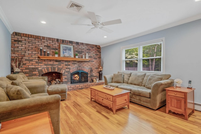 7 Jacqueline Ct, Port Jefferson Station, NY 11776 - living room with crown molding, light wood-style flooring, a ceiling fan, a fireplace, and recessed lighting