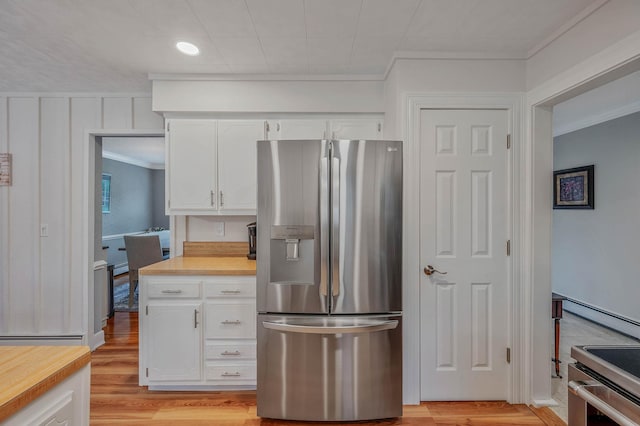 7 Jacqueline Ct, Port Jefferson Station, NY 11776 - kitchen with stainless steel appliances, crown molding, white cabinetry, light wood-style flooring, and a baseboard heating unit