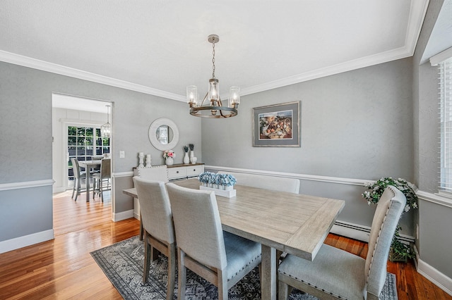 7 Jacqueline Ct, Port Jefferson Station, NY 11776 - dining space with a chandelier, wood finished floors, and ornamental molding