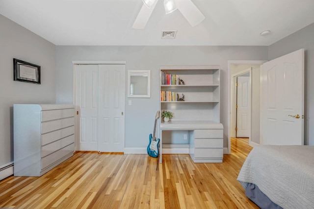 7 Jacqueline Ct, Port Jefferson Station, NY 11776 - unfurnished bedroom featuring light wood finished floors, a closet, a ceiling fan, and a baseboard radiator