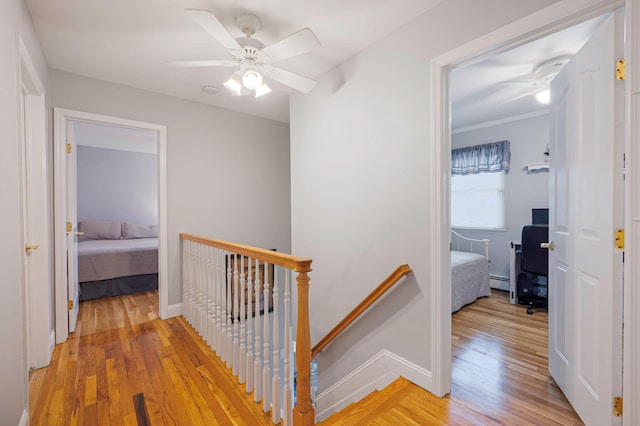 7 Jacqueline Ct, Port Jefferson Station, NY 11776 - hallway with an upstairs landing, light wood-type flooring, and baseboard heating
