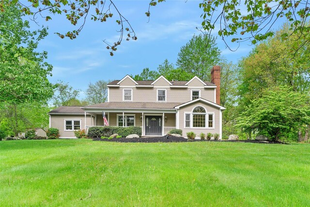 521 Plattekill Ardonia Rd, Wallkill, NY 12589 - view of front of house featuring a chimney, a porch, and a front lawn