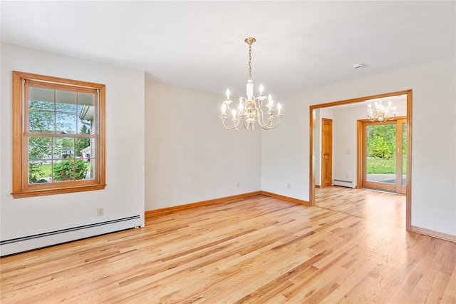 521 Plattekill Ardonia Rd, Wallkill, NY 12589 - unfurnished dining area featuring a chandelier, baseboard heating, light wood-style flooring, and baseboards