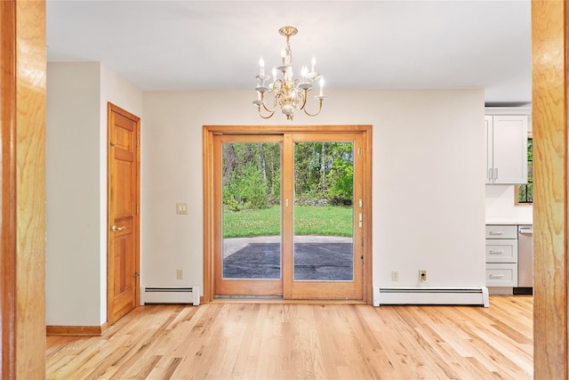 521 Plattekill Ardonia Rd, Wallkill, NY 12589 - entryway with a baseboard heating unit, light wood-style floors, a chandelier, and baseboards