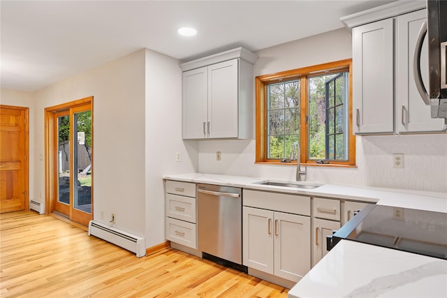 521 Plattekill Ardonia Rd, Wallkill, NY 12589 - kitchen with stainless steel dishwasher, a sink, a baseboard heating unit, baseboard heating, and light wood finished floors