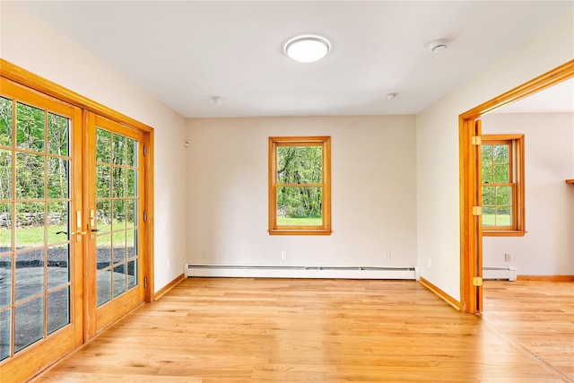 521 Plattekill Ardonia Rd, Wallkill, NY 12589 - unfurnished room with healthy amount of natural light, light wood-style floors, baseboards, and a baseboard heating unit